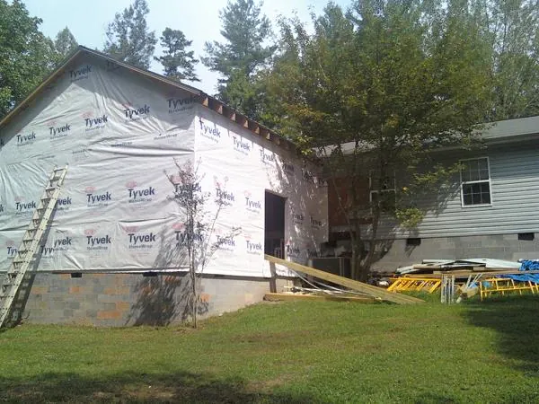 Tyvek wrapped gable on a new room addition beside an existing home in Blacklick